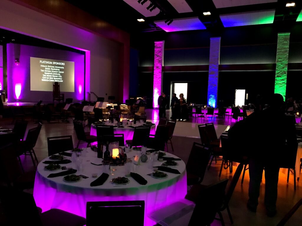 Banquet tables lit up with LED par can lights